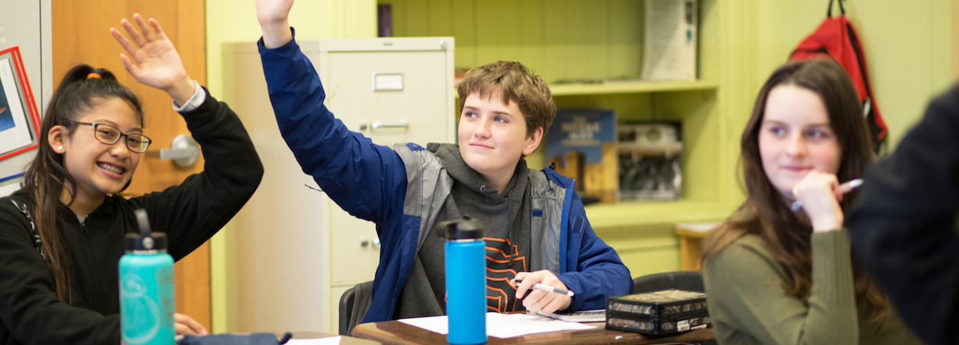 Gateway kids raising their hands