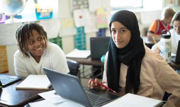 two students smiling