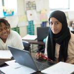 two students smiling